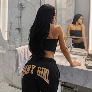 Black sweat pants, orange lettering 🍊